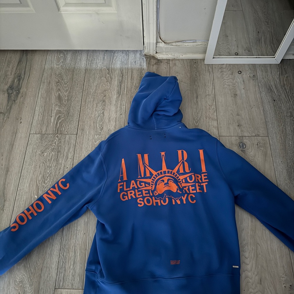 Amiri Blue Hoodie with Orange Graphics